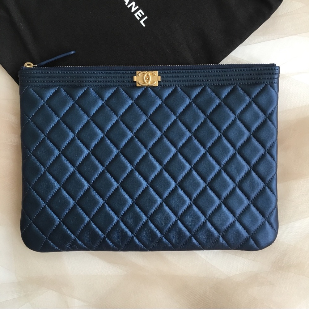 Brand new Chanel pouch clutch navy gold